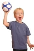 8685917-portrait-of-a-young-boy-throwing-a-ball